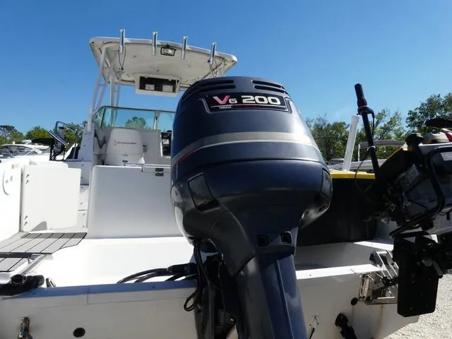 Slide: The Image of 2002 Seaswirl Striper 2301 boat with V6 200 engine, rear view. - 7