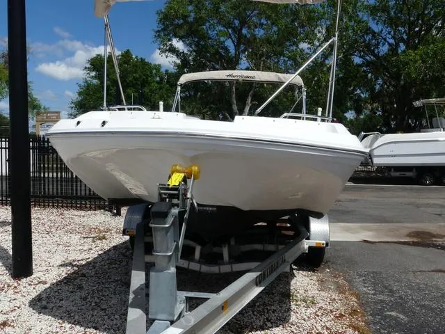 Slide: The Image of 2014 Hurricane SS 188 OB boat on trailer, parked outdoors under clear sky. - 2