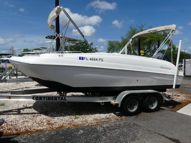 Slide: The Image of 2014 Hurricane SS 188 OB boat on trailer, parked outdoors under a clear sky. - 3