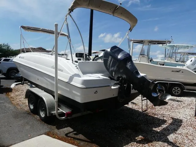 Slide: The Image of 2014 Hurricane SS 188 OB boat on trailer, parked outdoors under clear sky. - 4