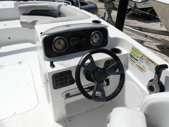 Slide: The Image of 2014 Hurricane SS 188 OB boat dashboard with steering wheel and gauges. - 7
