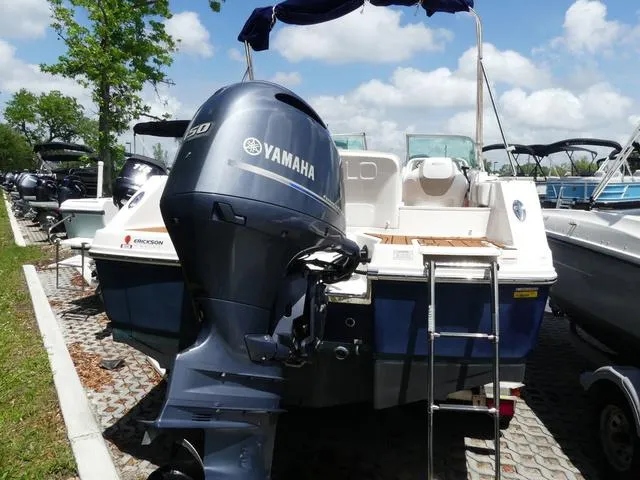 Slide: The Image of 2019 Robalo R207 boat with Yamaha outboard motor, parked in a marina. - 5