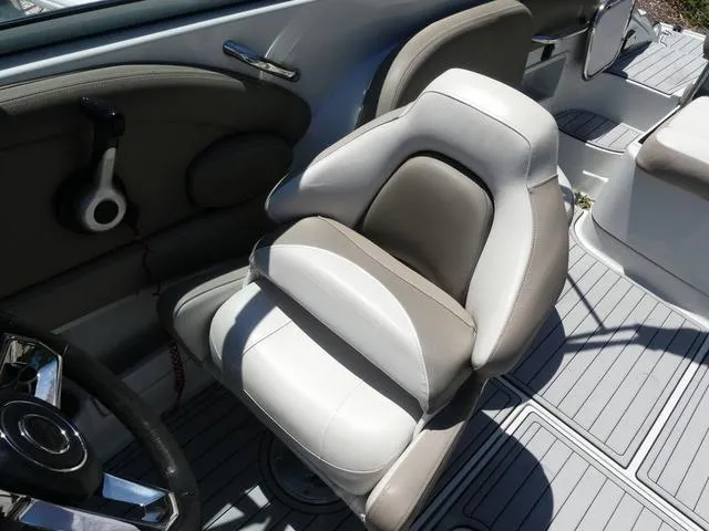 Slide: The Image of 2018 Crownline E23 XS boat interior with plush seating and modern design. - 11