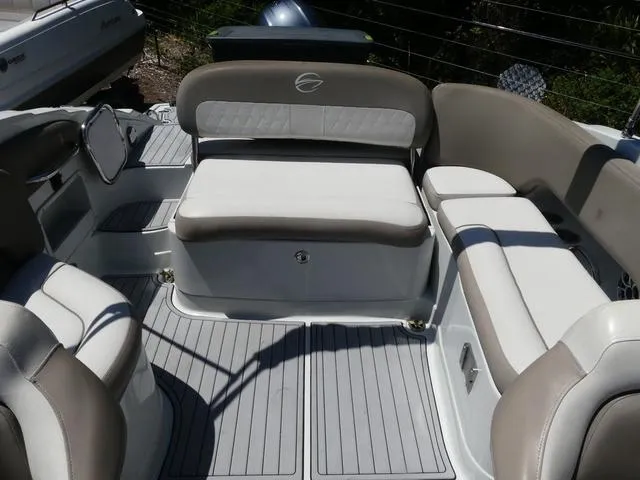 Slide: The Image of 2018 Crownline E23 XS boat interior with cushioned seating and sleek design. - 12