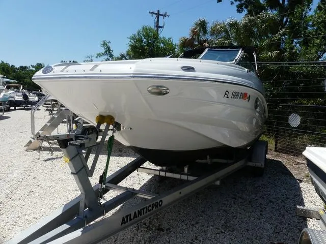 Slide: The Image of 2018 Crownline E23 XS boat on trailer in outdoor setting. - 3