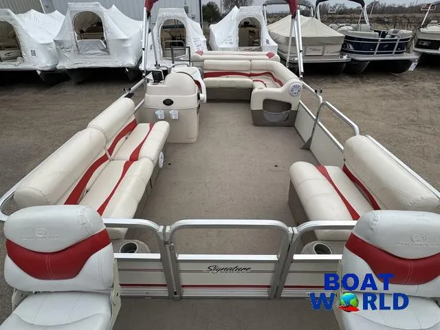 Slide: The Image of 2006 Sun Tracker Party Barge 20 Pontoon with spacious seating, parked outdoors. - 11
