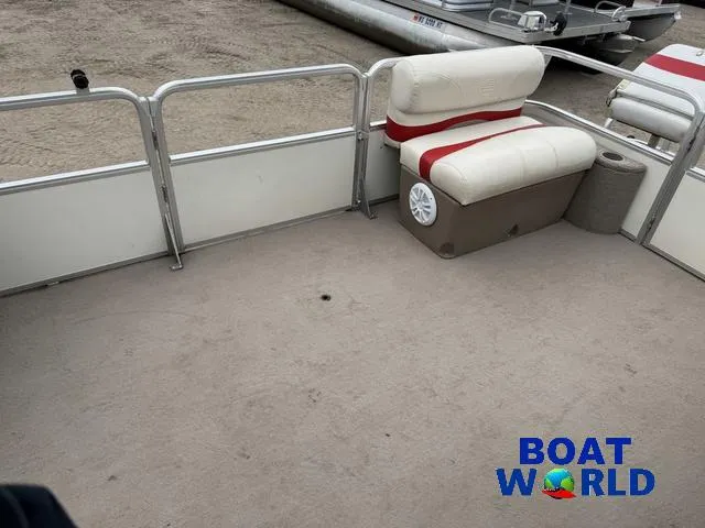 Slide: The Image of 2006 Sun Tracker Party Barge 20 Pontoon interior with seating and open deck space. - 13