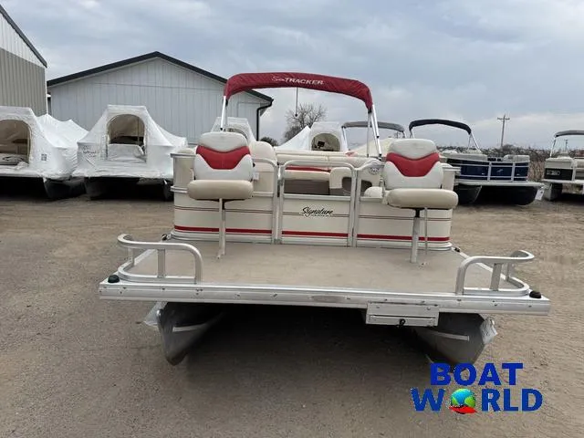 Slide: The Image of 2006 Sun Tracker Party Barge 20 Pontoon boat in a storage yard. - 14