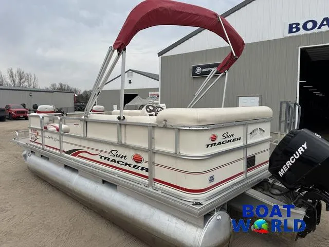 Slide: The Image of 2006 Sun Tracker Party Barge 20 Pontoon with red canopy and Mercury outboard motor. - 28
