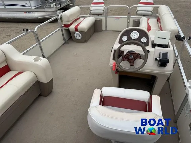 Slide: The Image of 2006 Sun Tracker Party Barge 20 Pontoon interior with seating and steering console. - 29