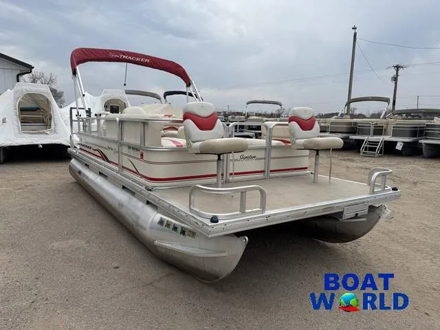 Slide: The Image of 2006 Sun Tracker Party Barge 20 Pontoon boat with red canopy, displayed at Boat World. - 35