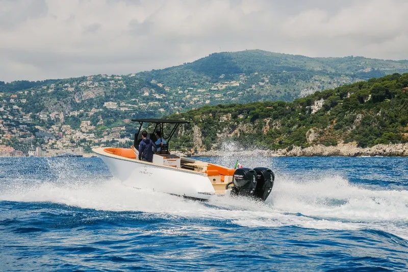 Slide: The Image of 2025 Lilybaeum Levanzo 25 Lounge Deck boat cruising on scenic coastal waters. - 9