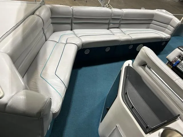 Slide: The Image of 1994 Harris-Kayot Heritage 2400 boat interior with gray seating and blue carpet. - 13