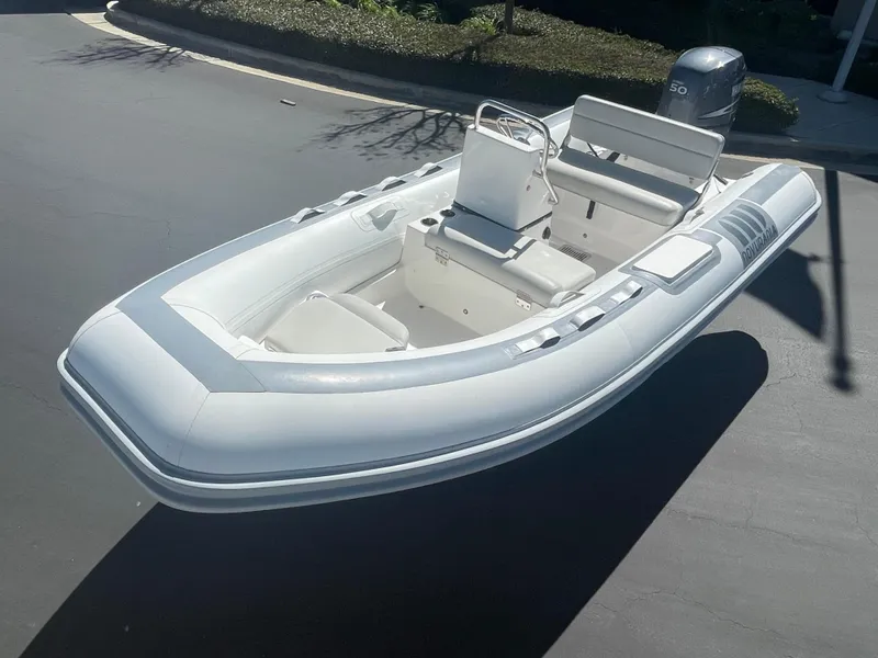 Slide: The Image of 2007 Novurania Deluxe 400 inflatable boat with seating and outboard motor. - 13