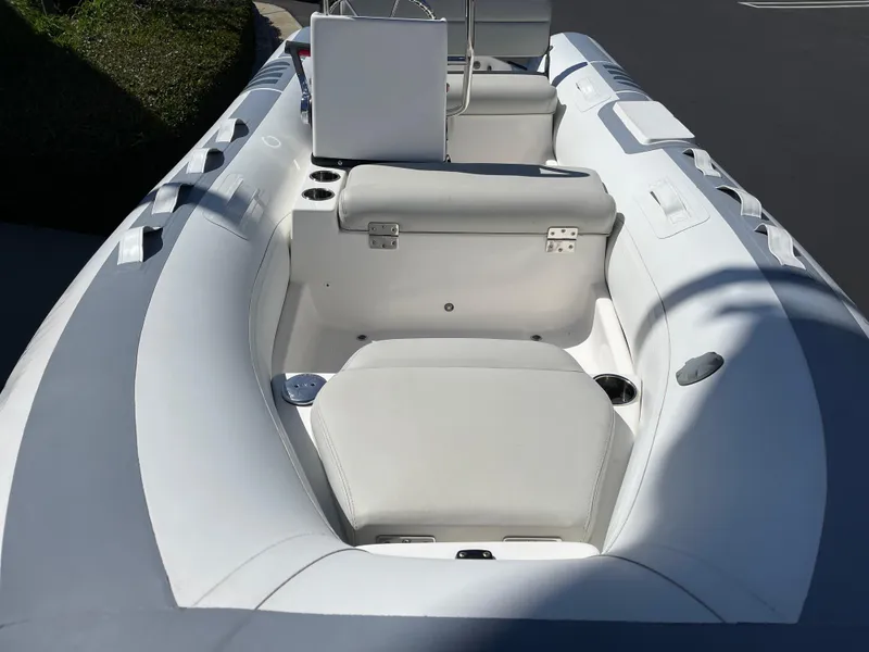 Slide: The Image of 2007 Novurania Deluxe 400 boat interior with white seating and console. - 4