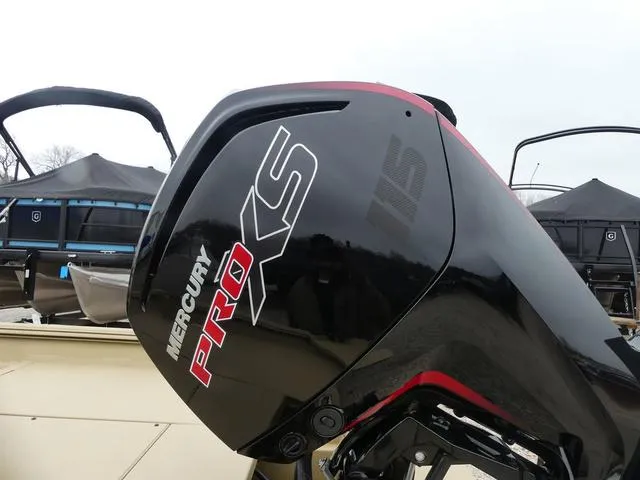 Slide: The Image of 2025 Lowe rx20CC boat dashboard with steering wheel and control panel. - 3