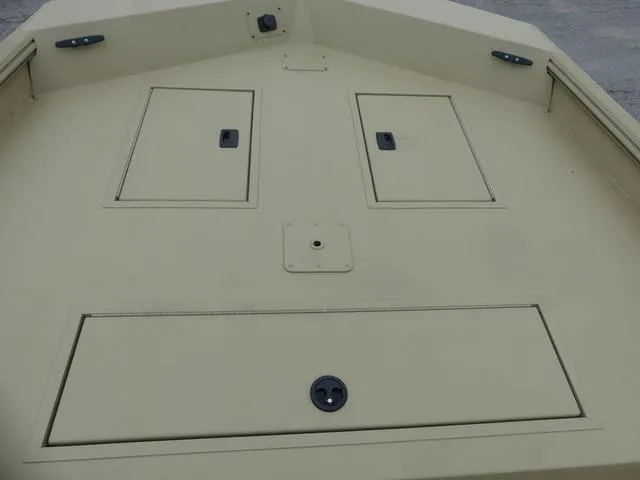 Slide: The Image of Open storage compartment on a 2025 Lowe rx20CC boat. - 5