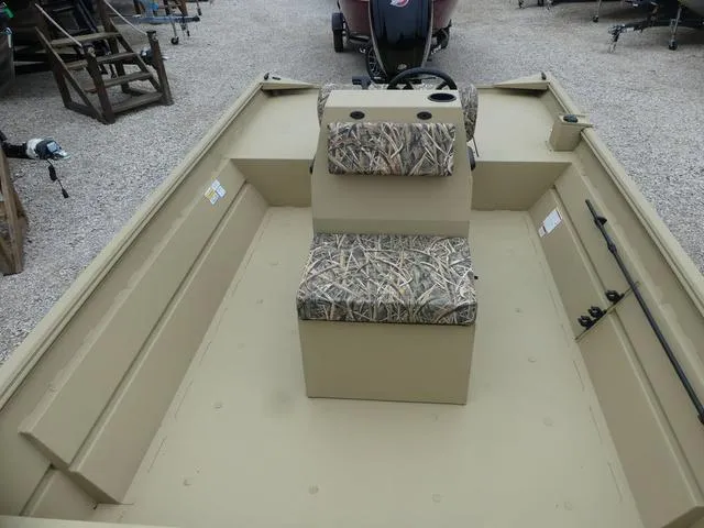 Slide: The Image of Open storage compartment in 2025 Lowe rx20CC boat. - 8