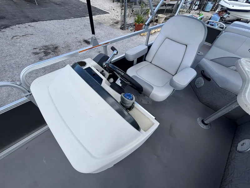 Slide: The Image of Captain's chair and console on 2013 Tahoe Pontoon AF 2280 FF boat. - 13