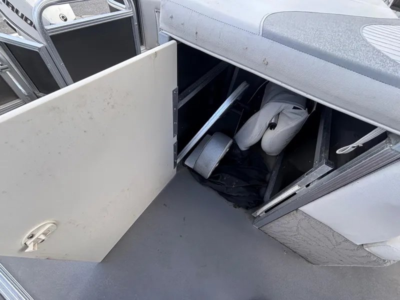 Slide: The Image of Open storage compartment in 2013 Tahoe Pontoon AF 2280 FF boat interior. - 15