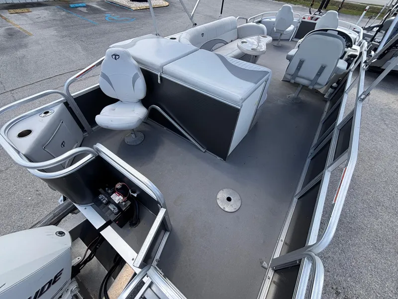 Slide: The Image of 2013 Tahoe Pontoon AF 2280 FF boat interior with seating and steering console. - 4