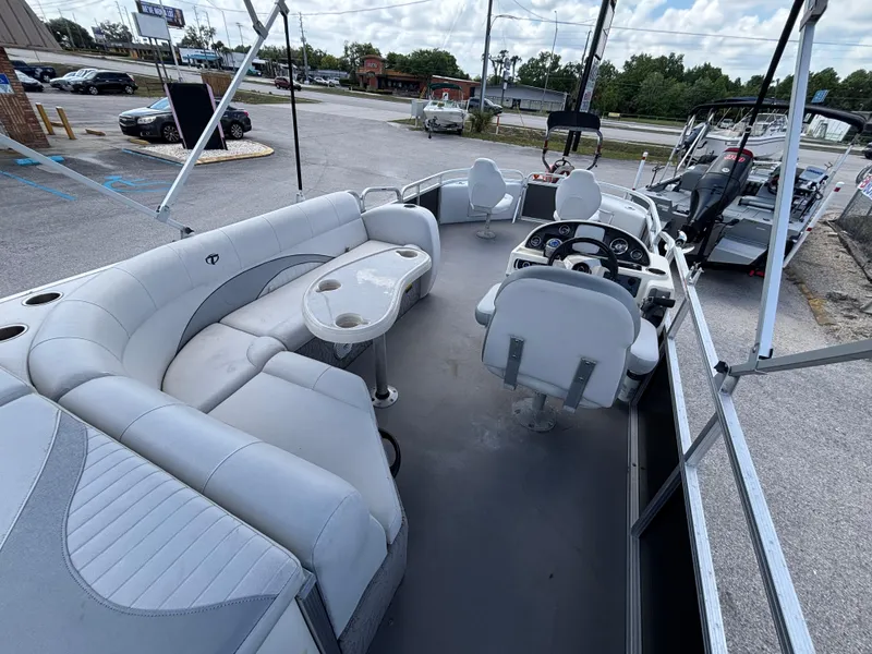 Slide: The Image of 2013 Tahoe Pontoon AF 2280 FF boat interior with seating and steering console. - 5