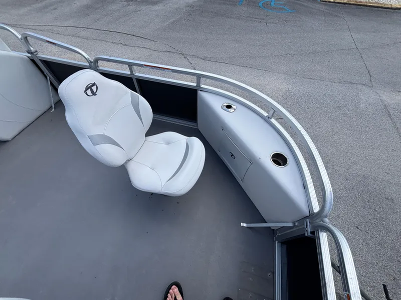 Slide: The Image of 2013 Tahoe Pontoon AF 2280 FF boat interior with white seating and railing. - 9