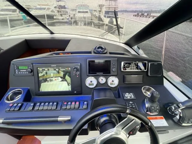 Slide: The Image of Helm of 2014 Jeanneau NC14 yacht with advanced navigation controls and displays. - 23