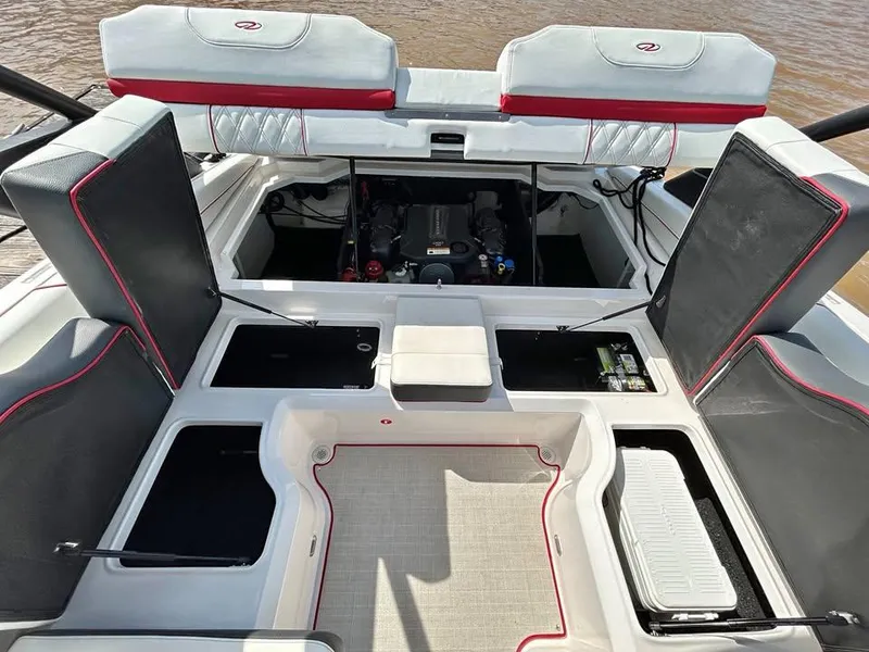 Slide: The Image of 2022 Regal LS2 boat interior with open engine compartment and seating. - 8