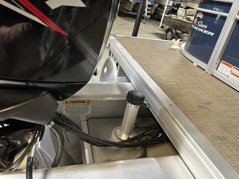 Slide: The Image of 2022 Sun Tracker PARTY BARGE® 20 DLX boat engine and deck detail in a showroom. - 11