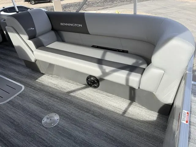 Slide: The Image of 2025 Bennington 21 S STERN RADIUS boat interior with gray seating and carpeted flooring. - 5