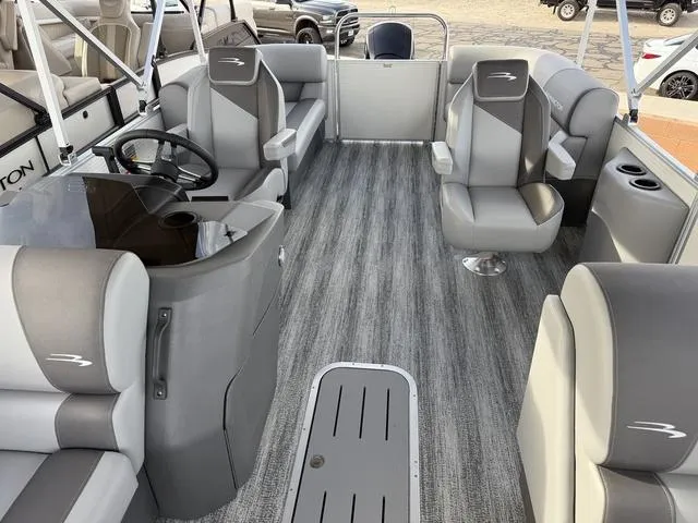 Slide: The Image of 2025 Bennington 21 S STERN RADIUS pontoon boat interior with gray seating and steering console. - 6