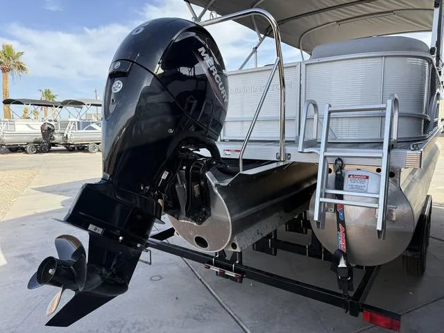 Slide: The Image of 2025 Bennington 21 S STERN RADIUS pontoon boat with Mercury outboard motor. - 9