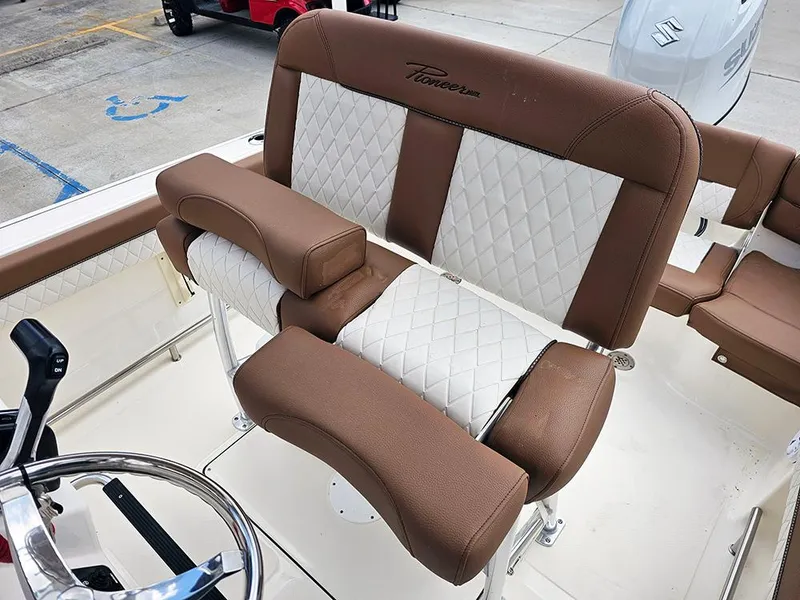 Slide: The Image of 2025 Pioneer 202 Islander boat seat with brown and white diamond-patterned upholstery. - 10