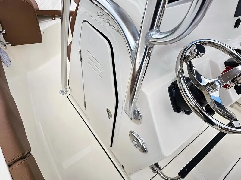 Slide: The Image of 2025 Pioneer 202 Islander boat interior with steering wheel and console details. - 14