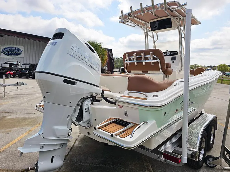 Slide: The Image of 2025 Pioneer 202 Islander boat on trailer, featuring sleek design and powerful outboard motor. - 6
