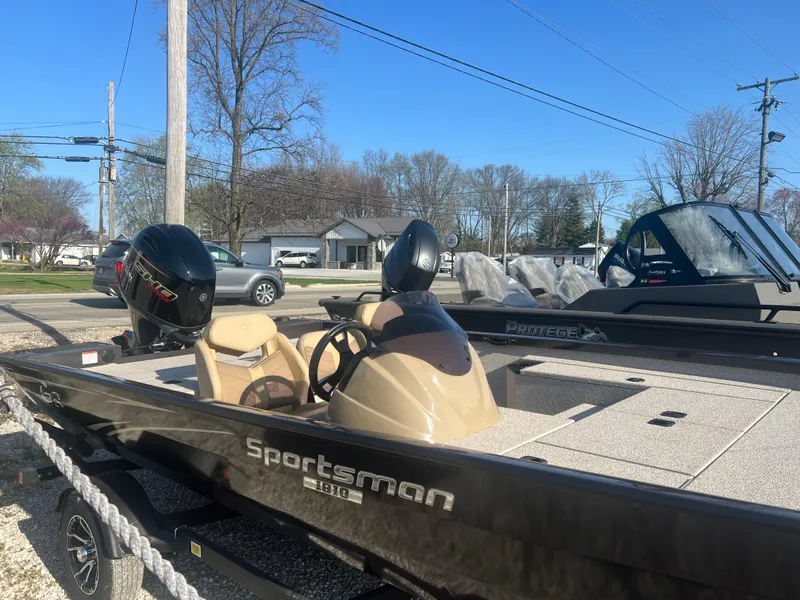 Slide: The Image of 2025 G3 Sportsman 1810 PFX boat on trailer, parked outdoors under clear sky. - 3