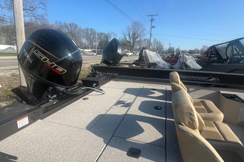 Slide: The Image of 2025 G3 Sportsman 1810 PFX boat with Yamaha engine, beige seating, and outdoor setting. - 8