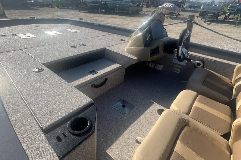 Slide: The Image of 2025 G3 Sportsman 1810 PFX boat interior with steering console and seating. - 9