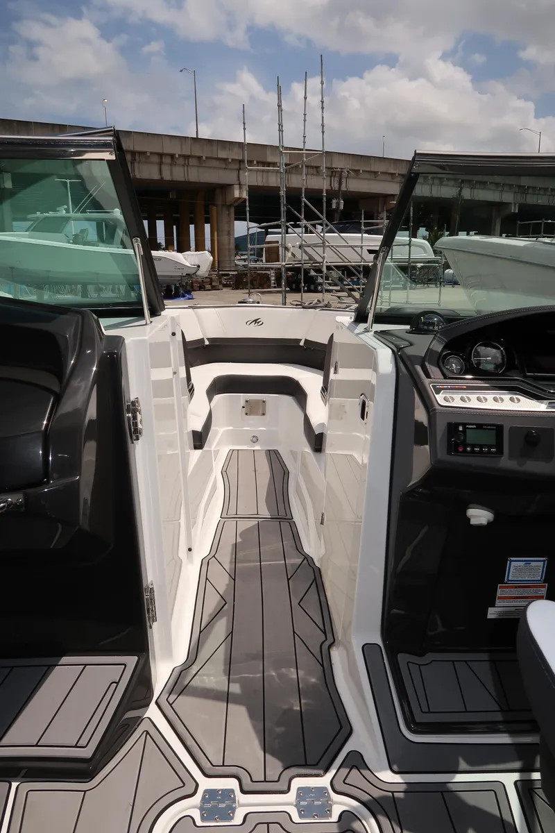 Slide: The Image of 2022 Monterey 275 Super Sport boat interior with sleek design and modern dashboard. - 10