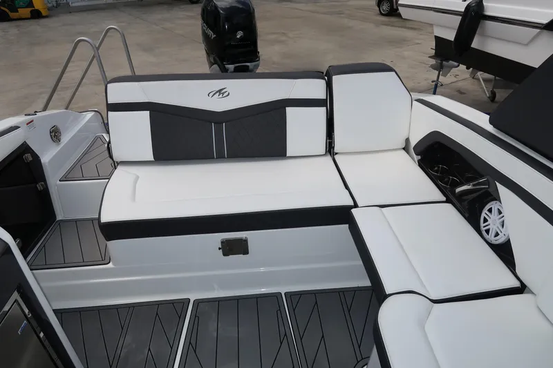 Slide: The Image of 2022 Monterey 275 Super Sport boat interior with sleek white and black seating. - 12