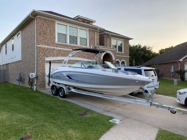 Slide: The Image of 2020 Chaparral 23 SSi boat on trailer parked in suburban driveway. - 4