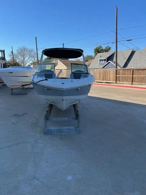 Slide: The Image of 2020 Chaparral 23 SSi boat on display in outdoor setting. - 9