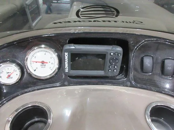 Slide: The Image of Dashboard of 2023 Sun Tracker Party Barge 18 DLX with gauges and Lowrance device. - 4