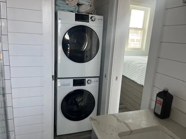 Slide: The Image of Stacked washer and dryer in modern bathroom, Harbor Cottage 16 x 84, 2020 model. - 21