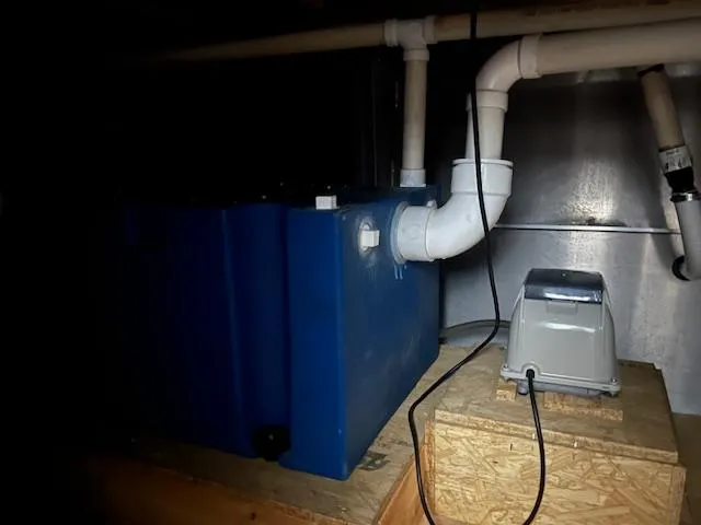 Slide: The Image of Blue water tank and plumbing system in a Harbor Cottage 16 x 84, 2020 model. - 24