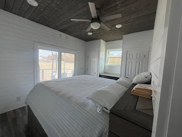Slide: The Image of Cozy bedroom in 2020 Harbor Cottage 16 x 84 with modern decor and large windows. - 26