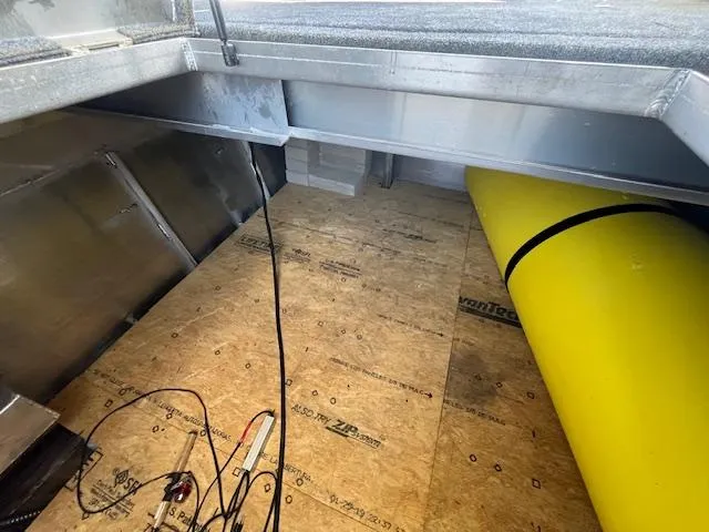 Slide: The Image of Interior view of a 2020 Harbor Cottage 16 x 84 houseboat, featuring underfloor storage. - 34