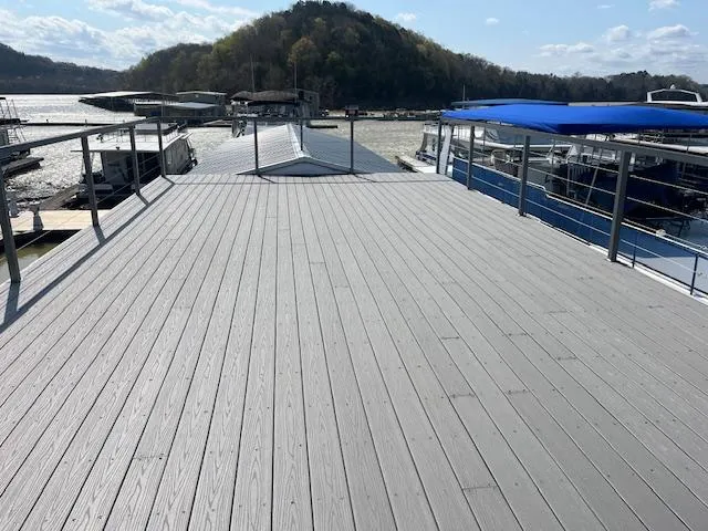 Slide: The Image of Rooftop deck of a 2020 Harbor Cottage 16 x 84 houseboat, overlooking a scenic waterfront. - 37
