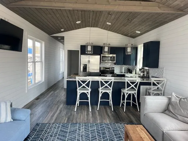 Slide: The Image of Modern kitchen and living area in 2020 Harbor Cottage 16 x 84 model. - 5